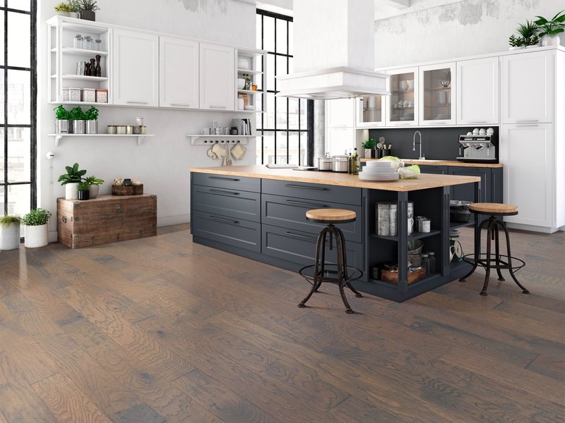 Kitchen with matte black cabinets and medium toned hardwood flooring from Wilmington Carpets in the Wilmington, OH area